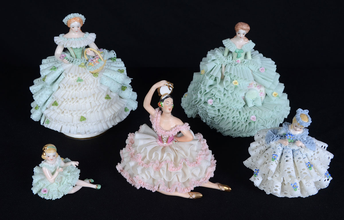 Appraisal: DRESDEN PORCELAIN LACY FIGURINES An assembled collection of tallest ''