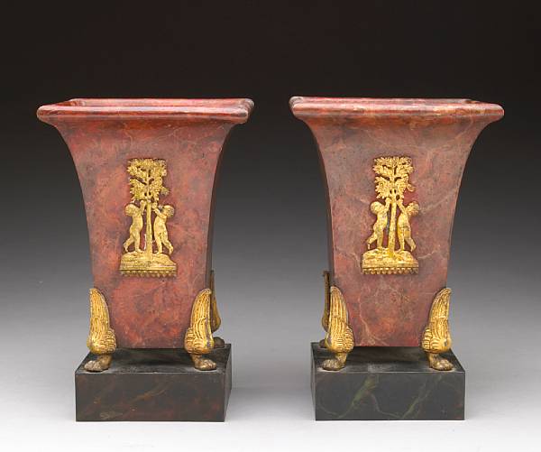 Appraisal: A pair of French faux marbleized and parcel gilt t