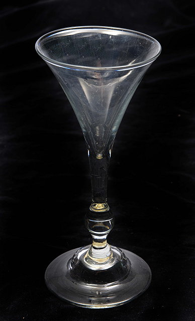 Appraisal: AN OLD WINEGLASS WITH CONICAL BOWL clear knoped stem and