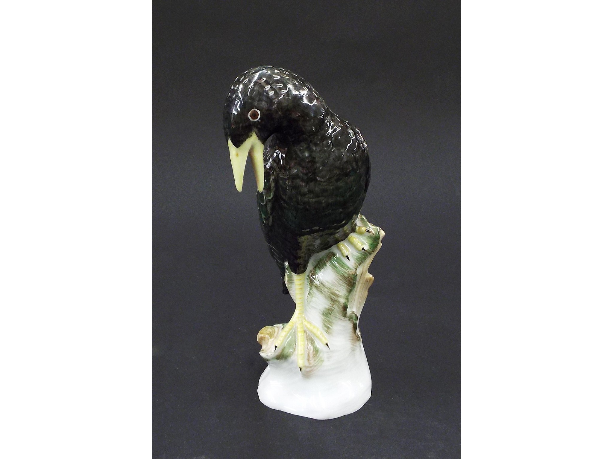 Appraisal: Berlin KPM porcelain figure of a dark bird with yellow