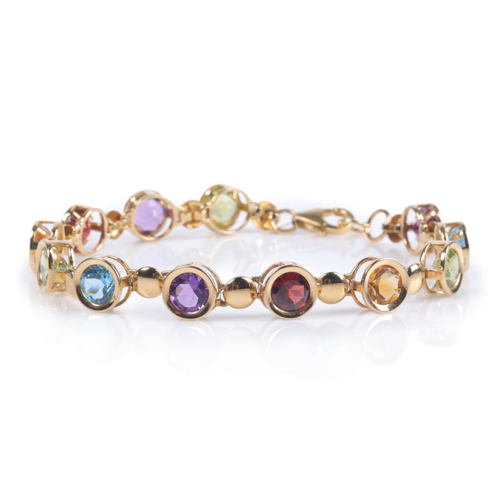 Appraisal: Carla K yellow gold bezel set gemstone link bracelet containing