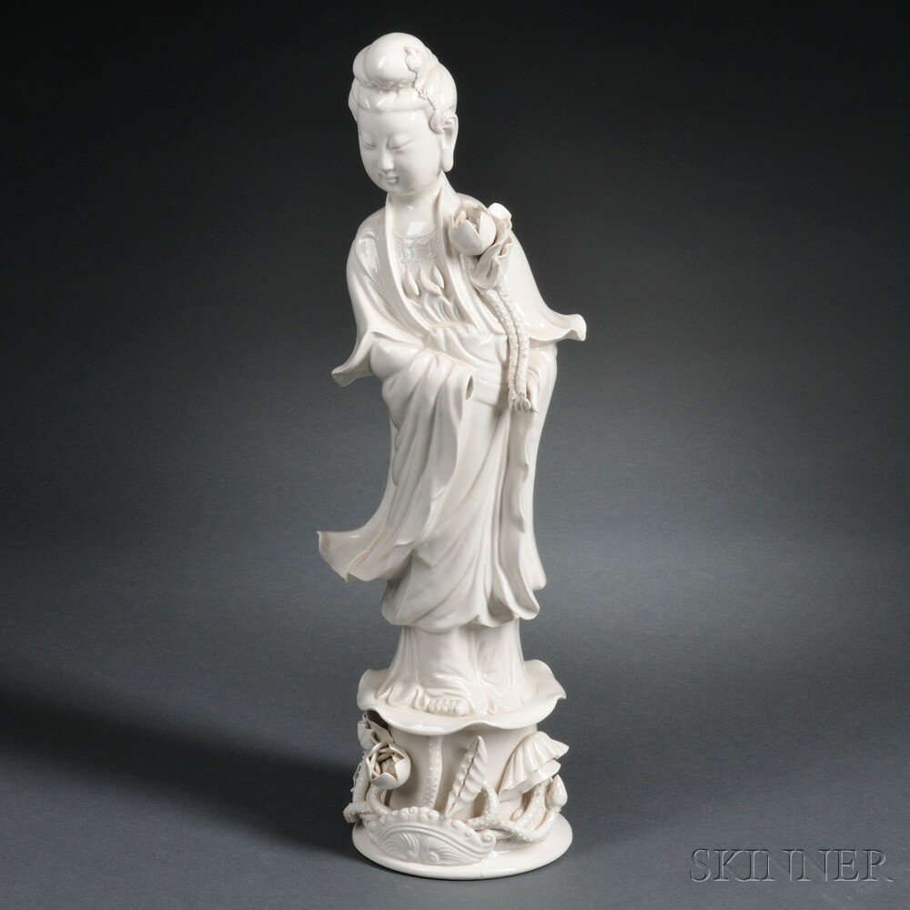 Appraisal: Blanc-de-chine Figure of Guanyin China th century with a lotus