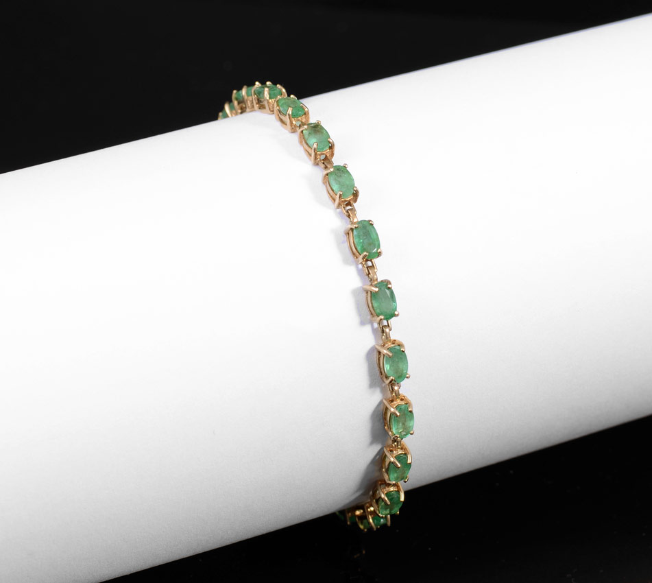 Appraisal: EMERALD TENNIS BRACELET oval mixed cut emeralds totaling approx Ct