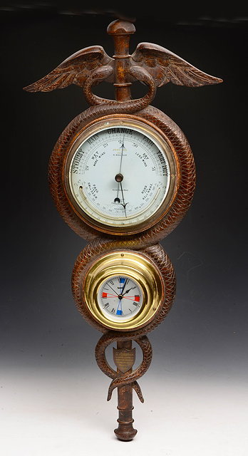 Appraisal: A CARVED OAK BAROMETER with circular dial signed John Nix