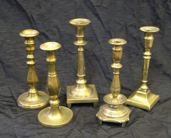 Appraisal: Interesting Collection of Five Brass Candlesticks consisting of a weighty