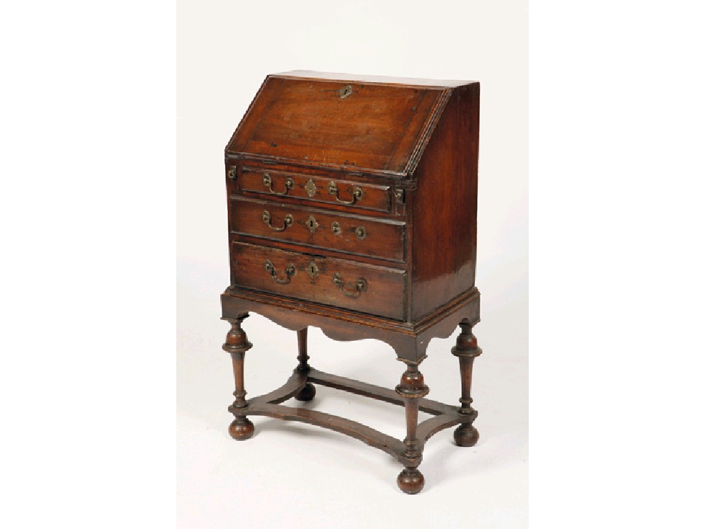 Appraisal: A QUEEN ANNE STYLE MINIATURE MAHOGANY BUREAU with a sloping