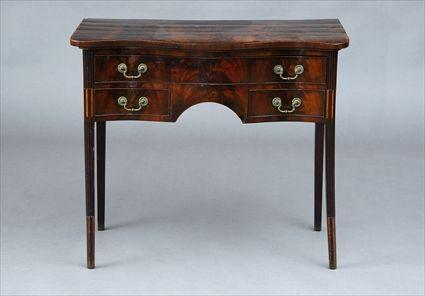 Appraisal: GEORGE III MAHOGANY DRESSING TABLE The serpentine top on a