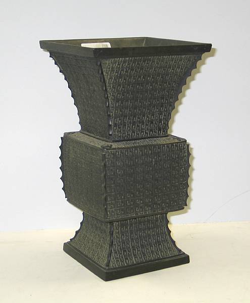 Appraisal: A bronze archaistic gu form vase Of square section imitating