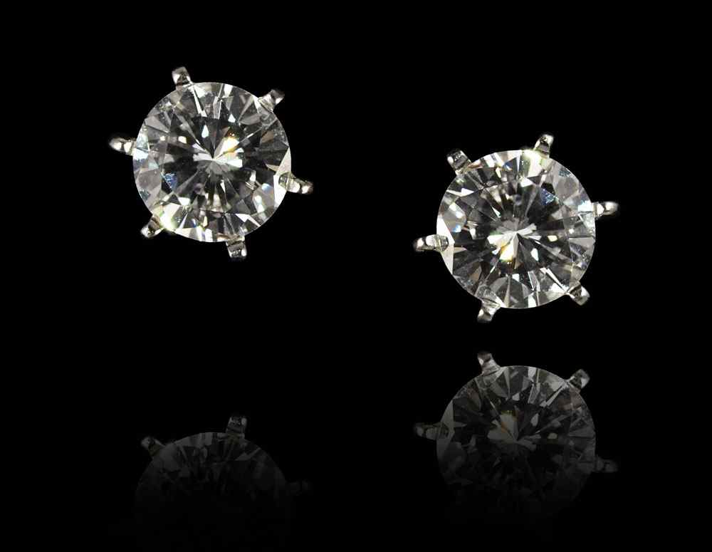 Appraisal: CT DIAMOND STUD EARRINGS K white gold solitaire earrings contain