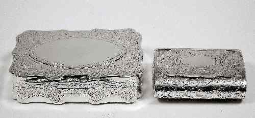 Appraisal: A Victorian silver rectangular snuff box of shaped outline engraved