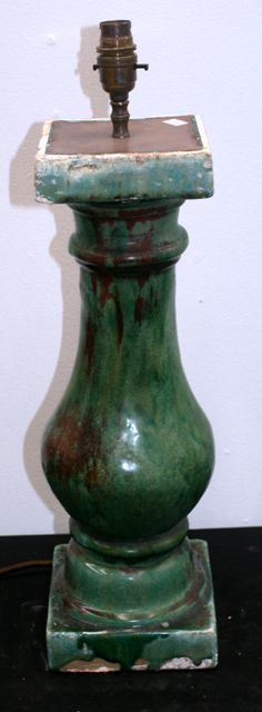 Appraisal: A lamp stand constructed from a green glazed Chinese bollard