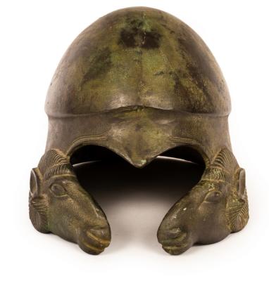 Appraisal: A bronze helmet after the antique modelled with cast rams