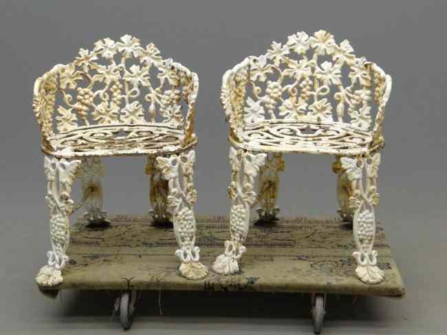 Appraisal: Pair cast iron garden chairs '' Overall Ht