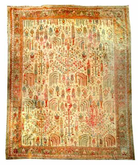 Appraisal: A TURKEY OUSHAK LARGE CARPET decorated in pastel colours with