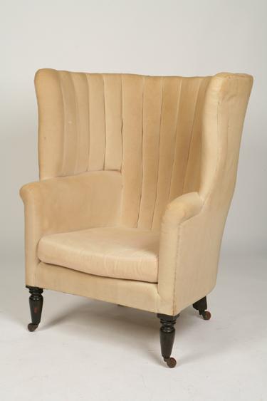 Appraisal: A TH CENTURY UPHOLSTERED WING BACK ARMCHAIR the broad tub