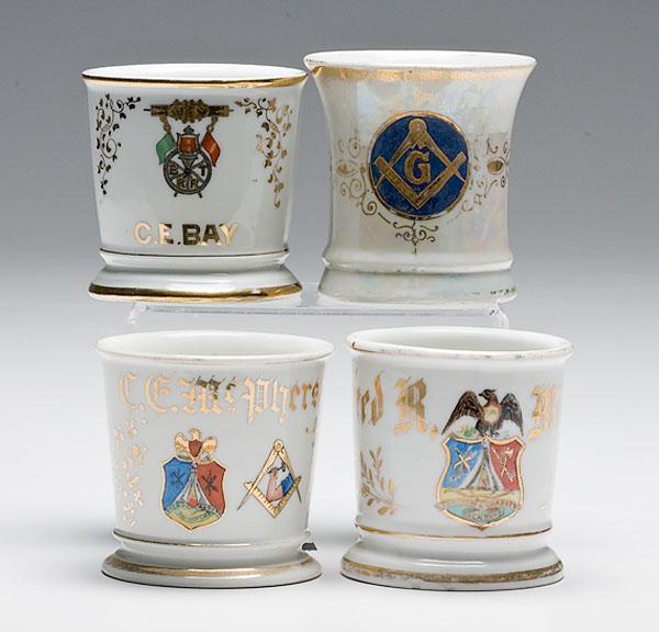 Appraisal: FOUR FRATERNAL SHAVING MUGS porcelain with polychrome painted fraternal symbols