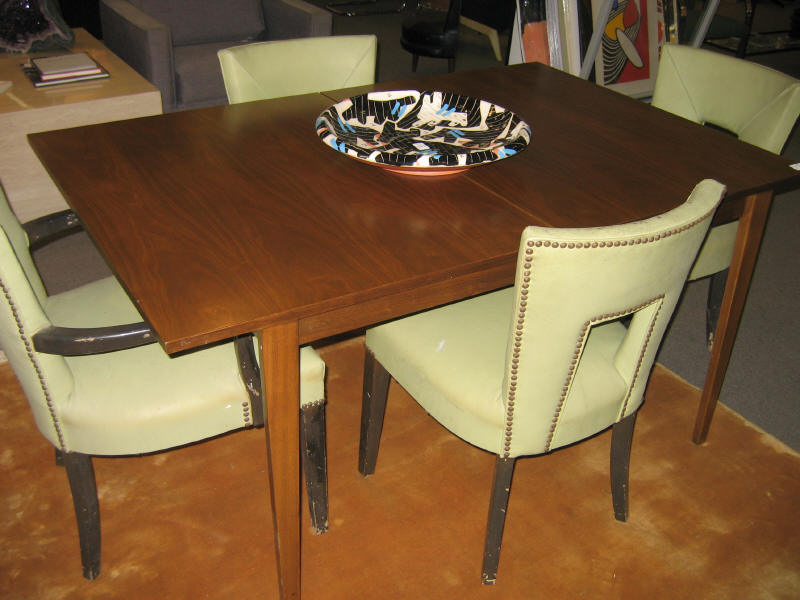 Appraisal: DUNBAR BERNE INDIANA Walnut dining table raised on tapering legs