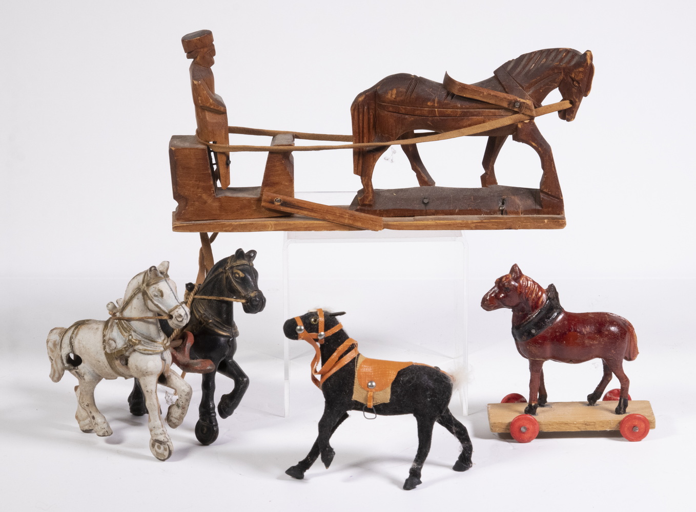 Appraisal: ASSORTED HORSE FIGURES Including Folk art carving of a man