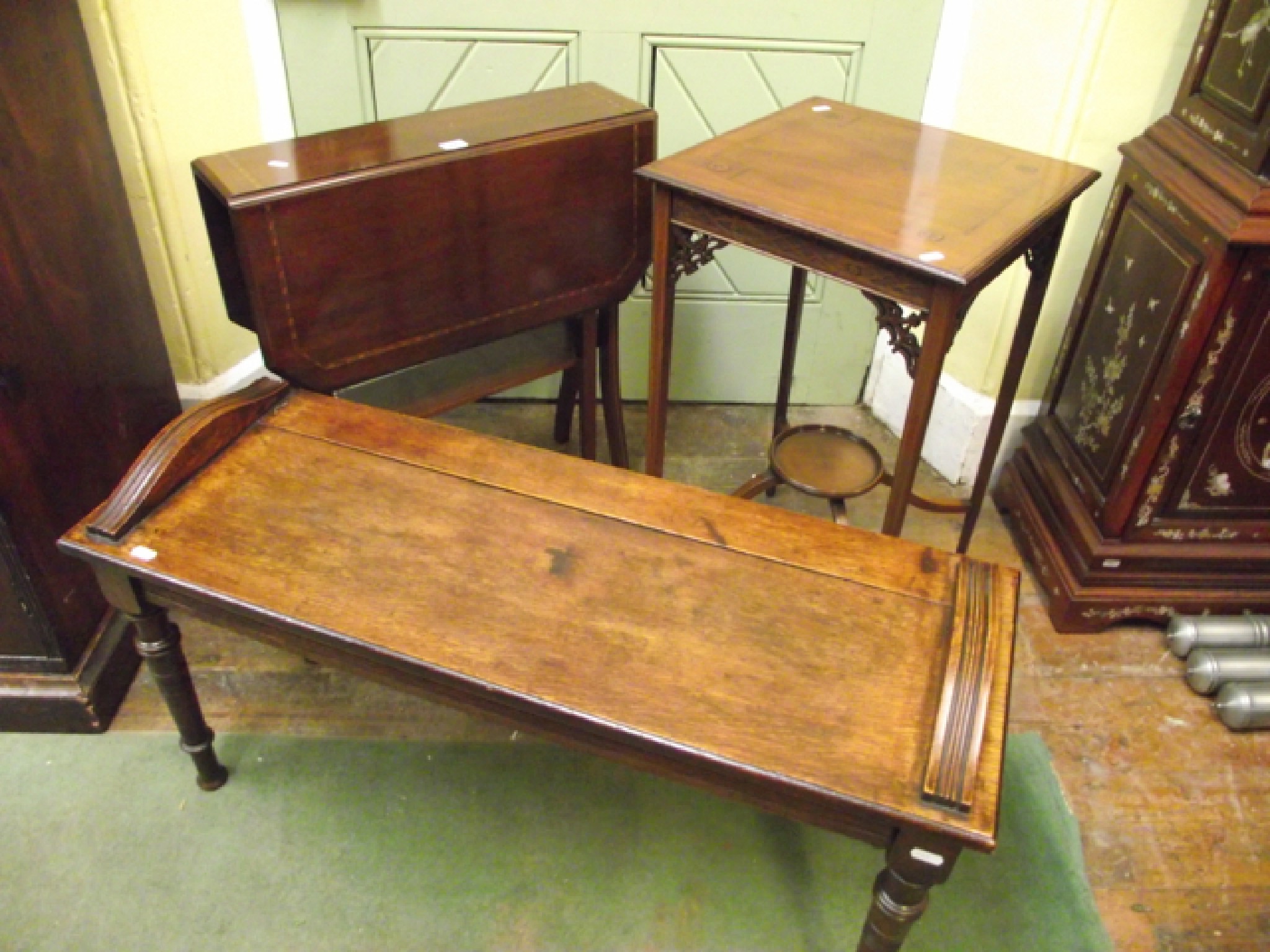 Appraisal: An inlaid Edwardian mahogany occasional table raised on square tapered