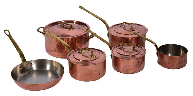 Appraisal: A SET OF HEAVY COPPER SAUCEPANS with cast brass handles