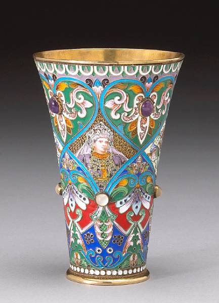 Appraisal: A silver gilt and shaded enamel beaker with applied cabochons