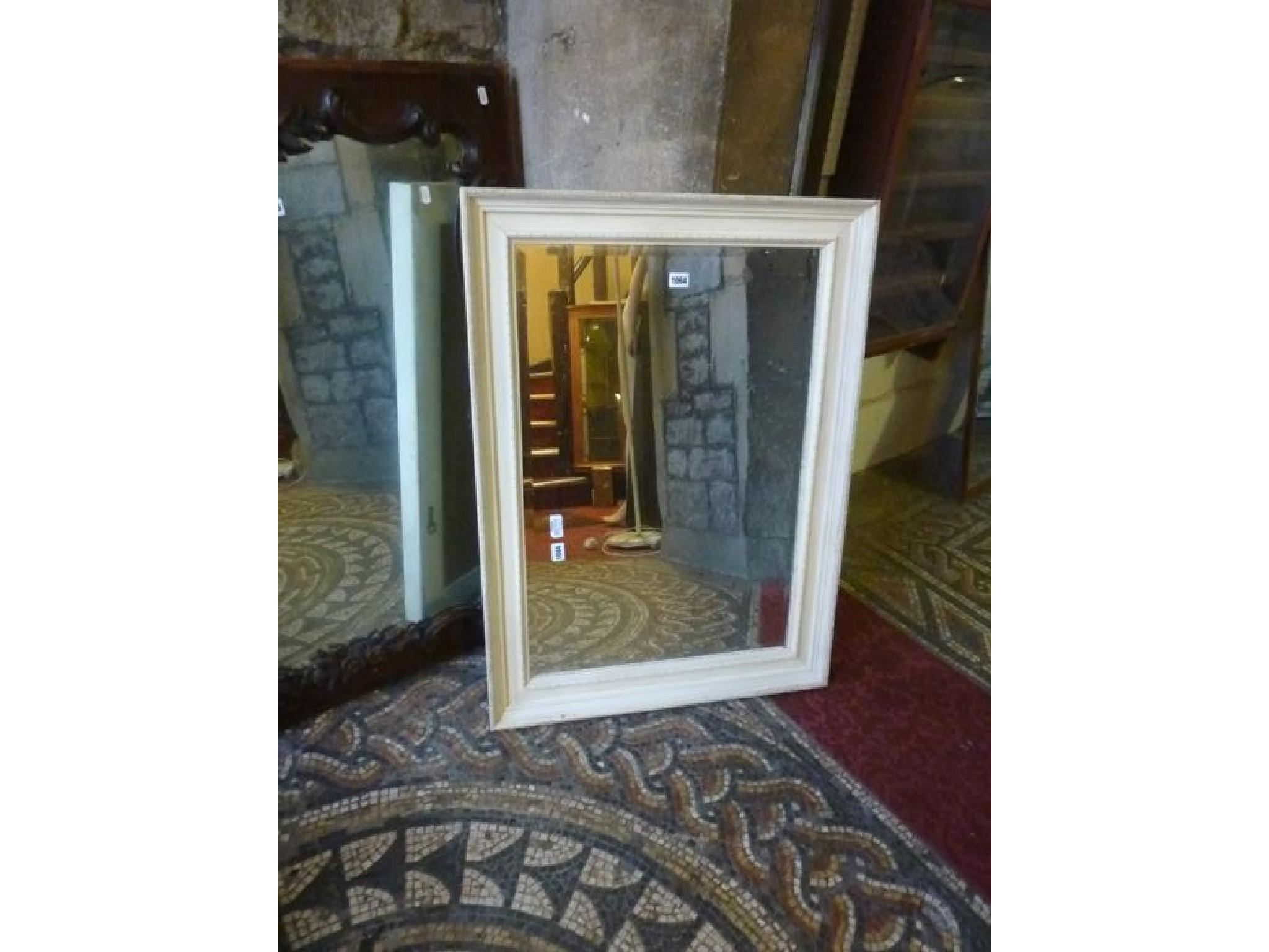 Appraisal: A rectangular wall mirror with painted and moulded frame and