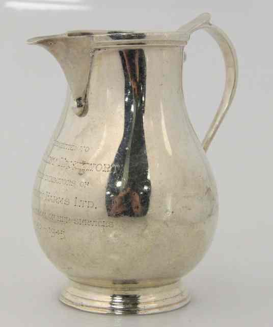 Appraisal: A silver jug Goldsmiths Silversmiths Co Ltd London of pear