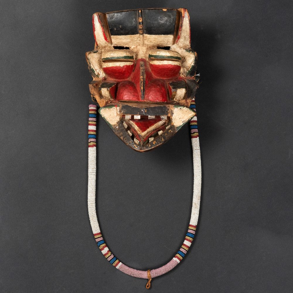 Appraisal: Painted Carved Wood and Beaded Mask Fitted with metal teeth