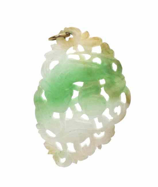 Appraisal: A Multi Color Carved Jade Pendant in a pierced fish