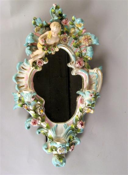 Appraisal: German porcelain shaped wall mirror late th early th century