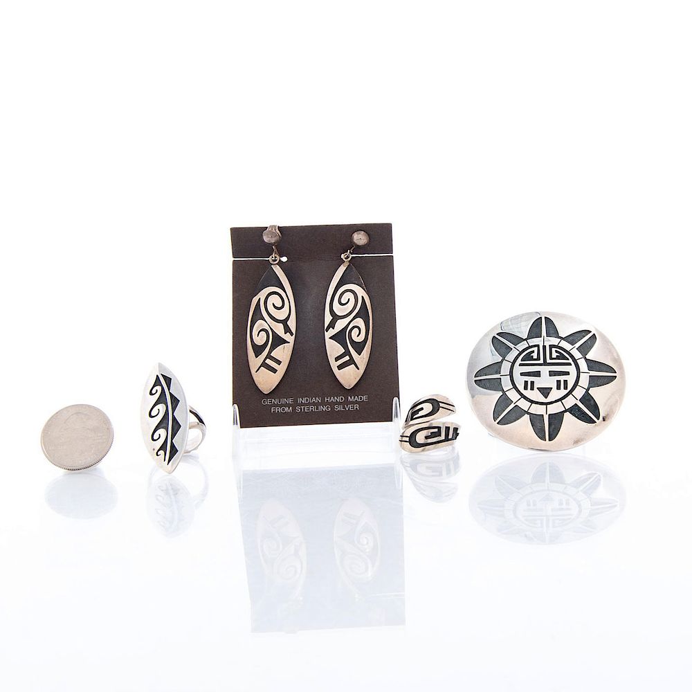 Appraisal: NATIVE AMERICAN SILVER EARRINGS RINGS AND PIN Silver with inlaid