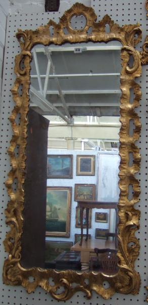 Appraisal: A George II giltwood wall mirror the rectangular plate within