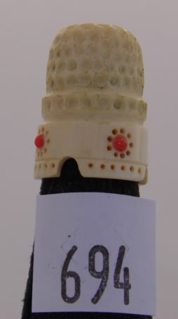 Appraisal: Ivory thimble with coral stones and indented rim