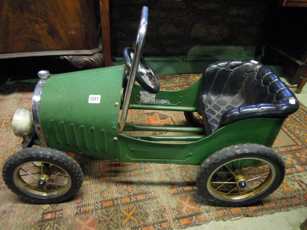 Appraisal: A child's veteran toy pedal car with simulated buttoned leather