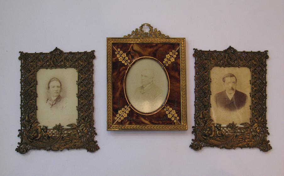 Appraisal: A PAIR OF VICTORIAN GILT METAL PHOTOGRAPH FRAMES with elaborate