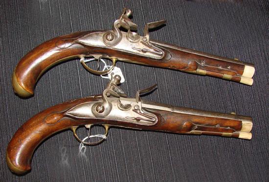 Appraisal: PAIR OF FLINTLOCK PISTOLS European th century Relief carved walnut