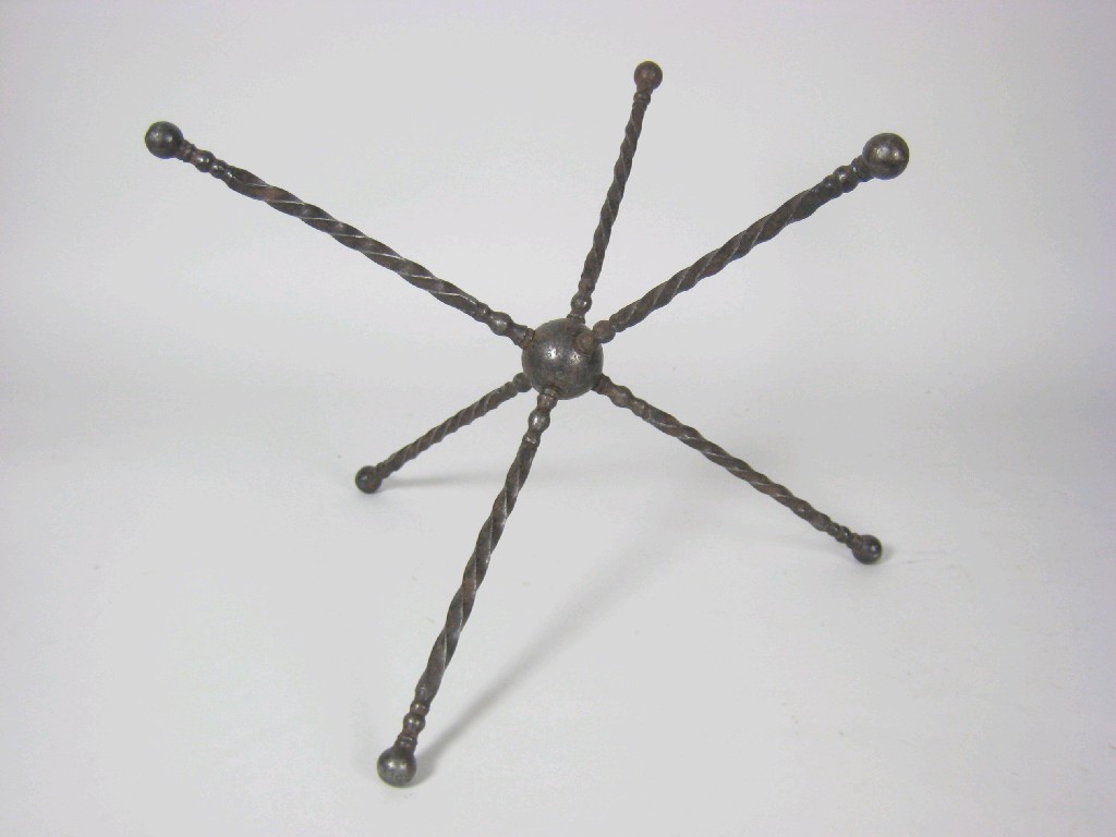 Appraisal: A rare th Century steel cat Trivet with spiral detail