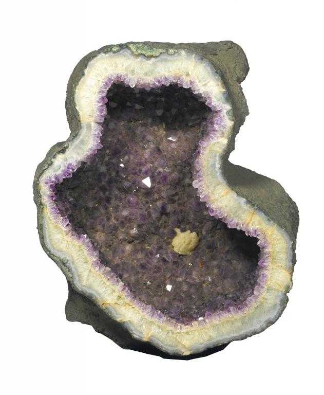 Appraisal: AN IMPRESSIVE LIMESTONE GEODE the cavernous interior of quartz and