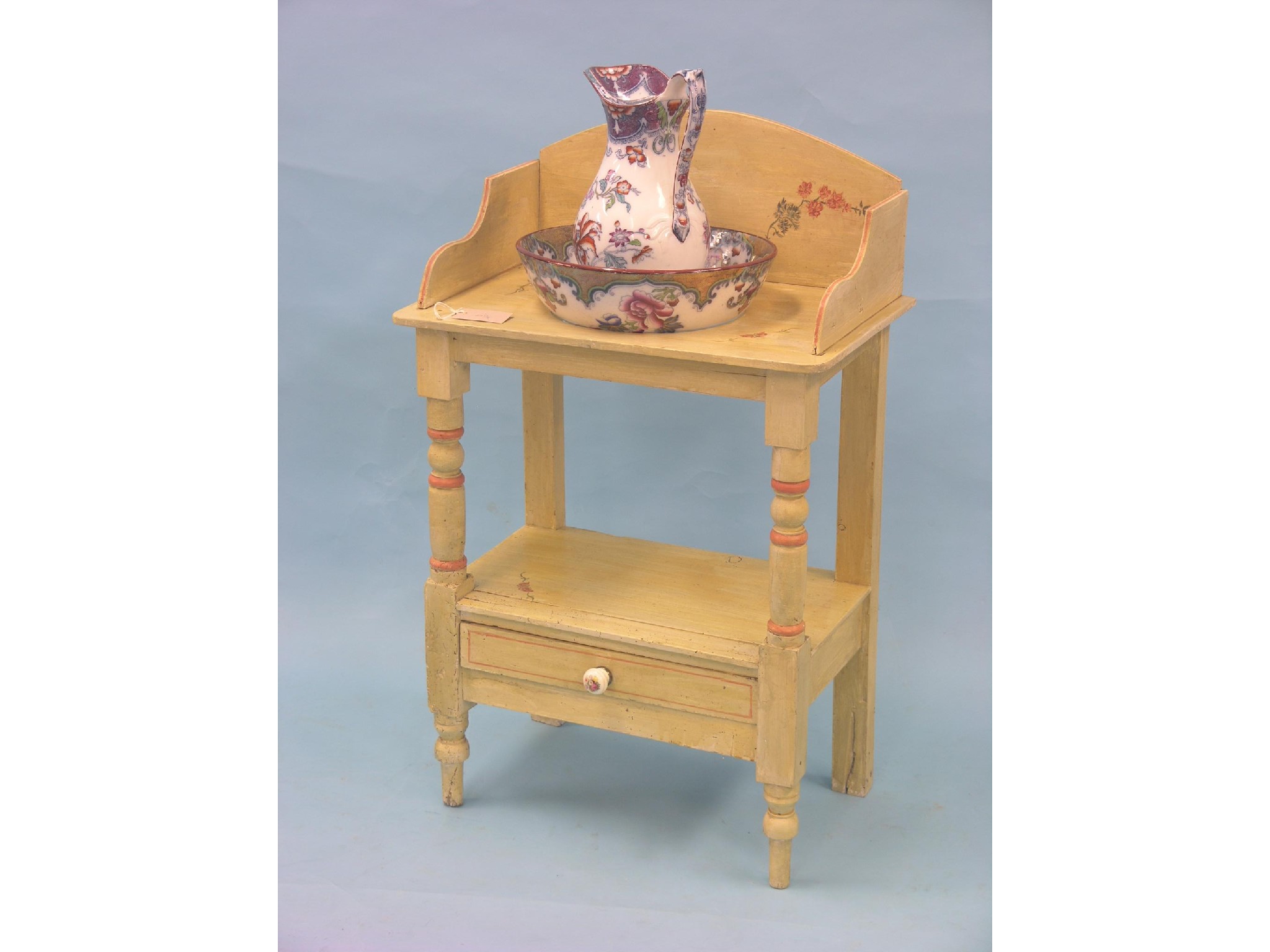 Appraisal: A painted pine washstand two-tiered with single drawer complete with