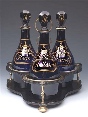 Appraisal: A TRIO OF BRISTOL BLUE DECANTERS each with gilt inscription