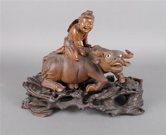 Appraisal: A Chinese Wood Carving of a Boy and a Buffalo