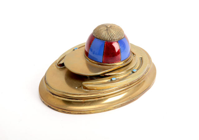 Appraisal: A brass inkstand surmounted by a horseshoe and a blue