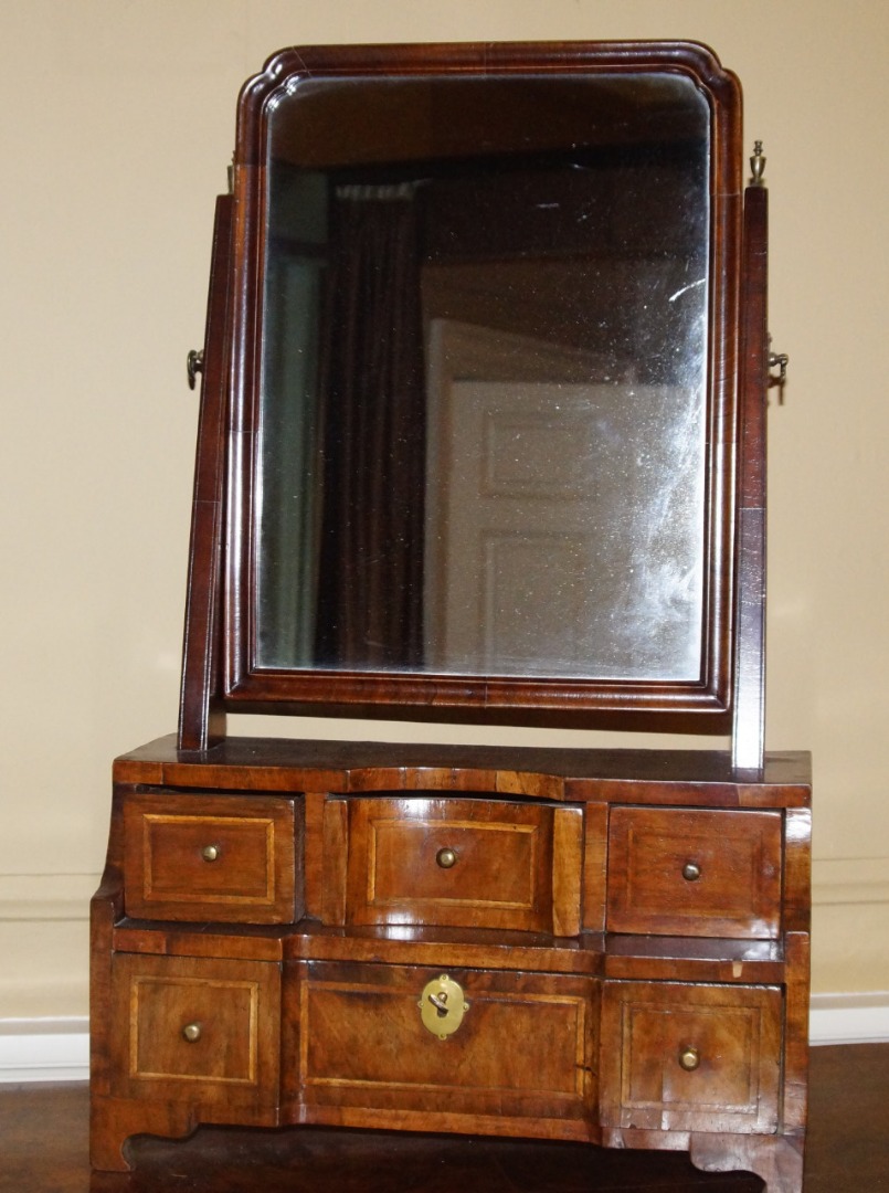 Appraisal: A walnut dressing table mirror the rectangular plate on tapering