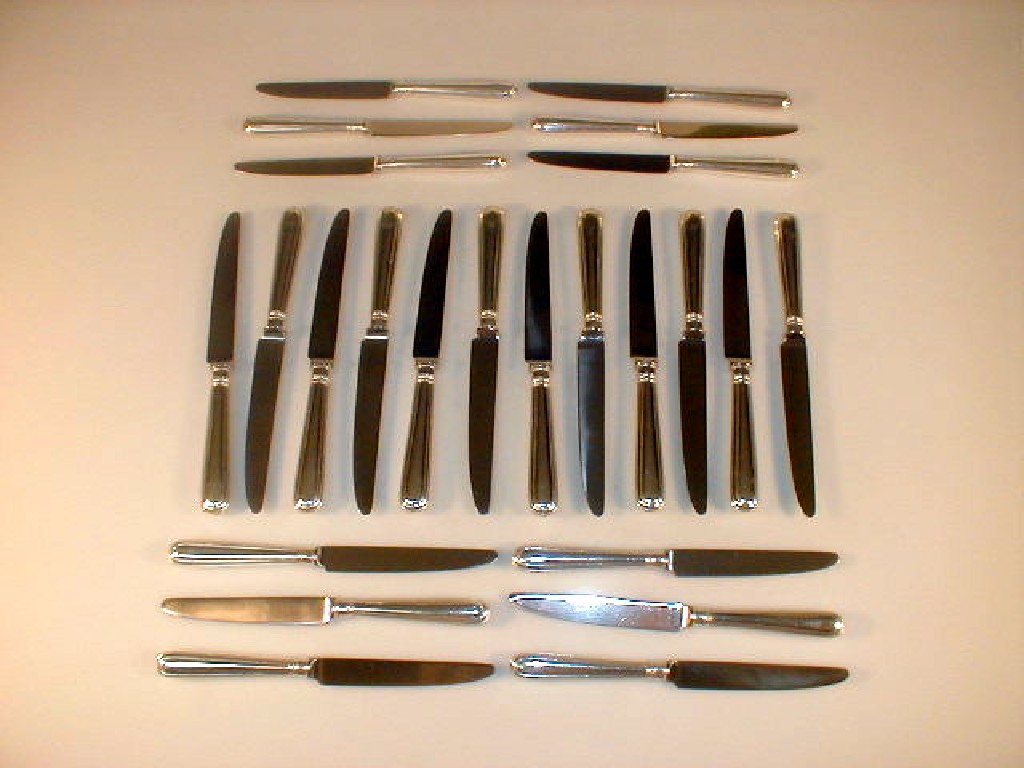 Appraisal: A set of twelve silver handled table knives and matching