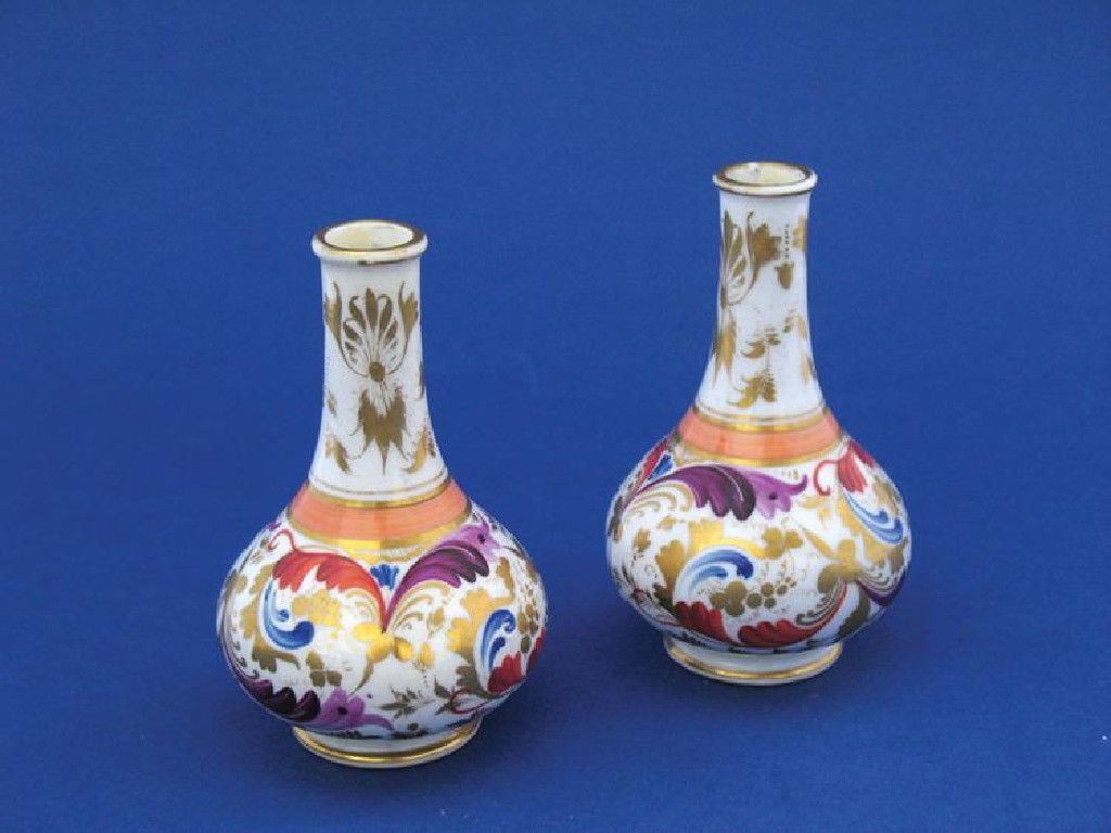 Appraisal: A PAIR OF MINIATURE DERBY BOTTLE VASES of ovoid form