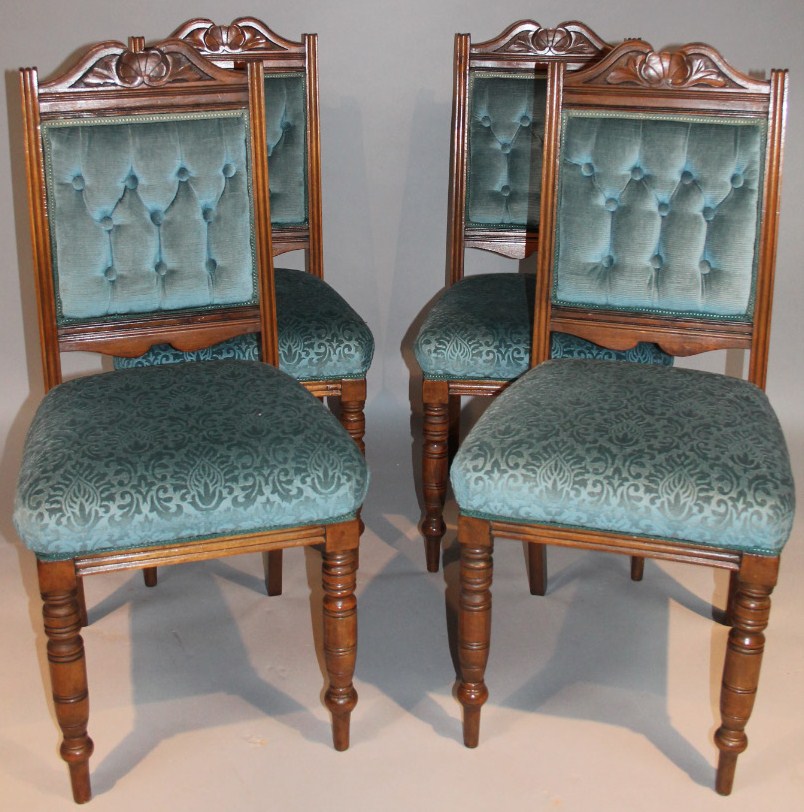 Appraisal: A set of four Edwardian walnut stained dining chairs each