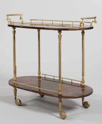 Appraisal: Aldo Tura Serving Trolley Racetrack shape two tier gilt brass