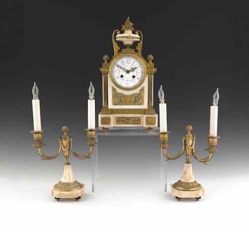 Appraisal: French ormolu and marble three-piece clock garniture ca the works