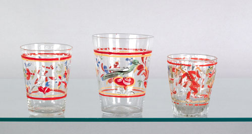 Appraisal: Three Stiegel type enamel decorated tumblers th c with bird