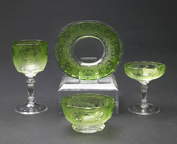 Appraisal: A Continental etched colored glass part dessert service engraved with